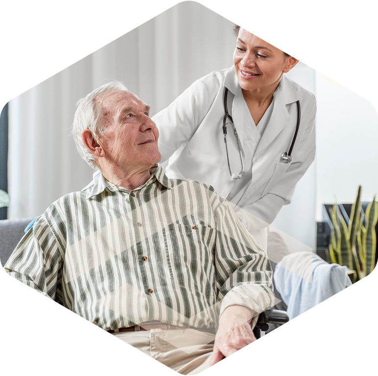 Caregiver smiling with an elderly resident