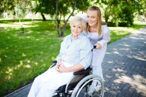 Adult daughter comforting elderly mother