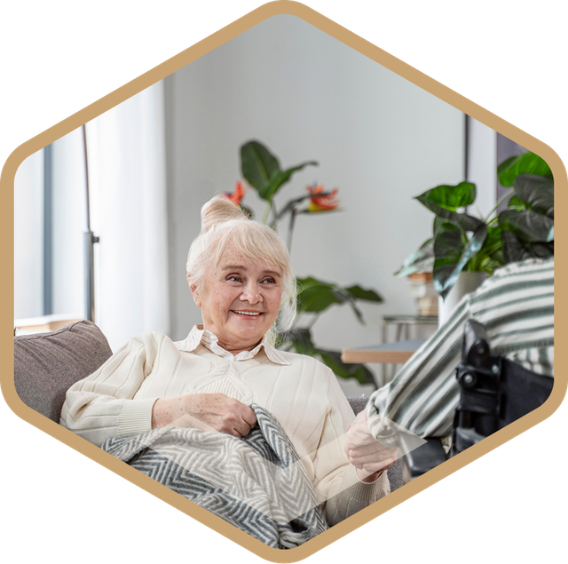Caregiver with an elderly resident smiling